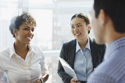 businesspeople standing talking