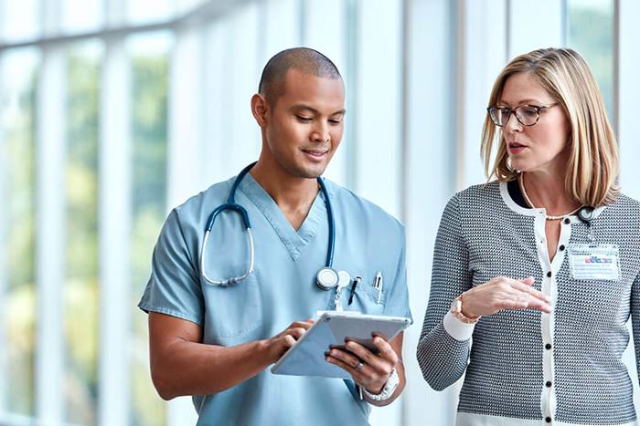 nurse and doctor talking