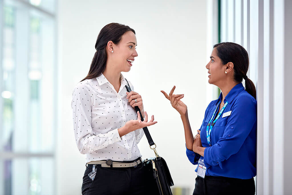 Custom Photo Sales rep and NHS doctor talking