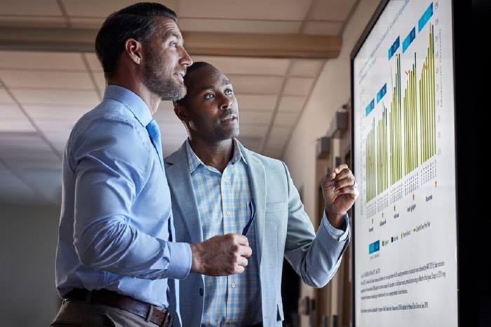 Custom Photo Two men looking at data screen