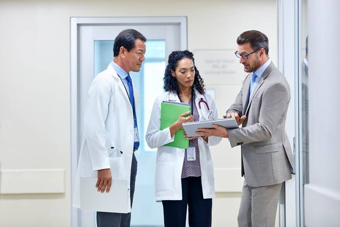 Custom Photo Sales person talking to group
