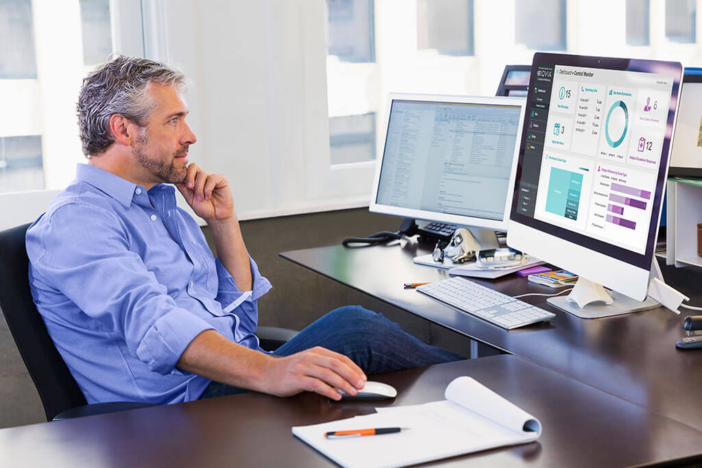 Casual businessman working at computer in office