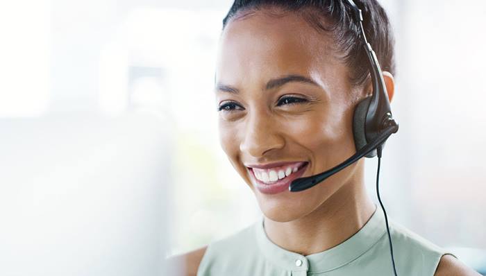 Woman in headset working at call center