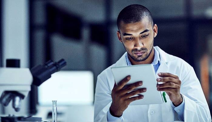 Scientist using tablet in lab