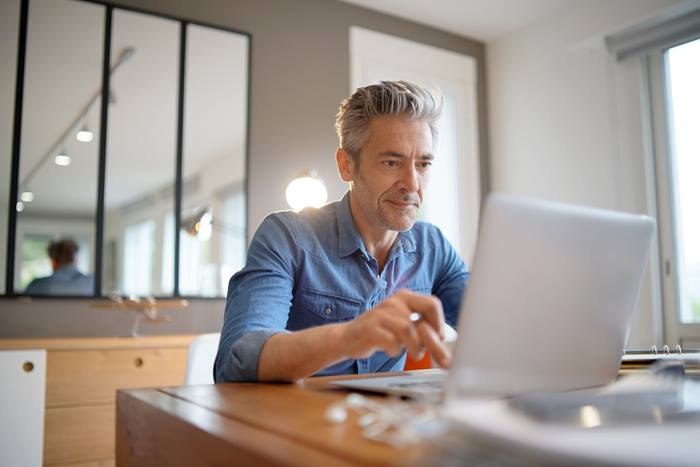 Middled aged man working from home