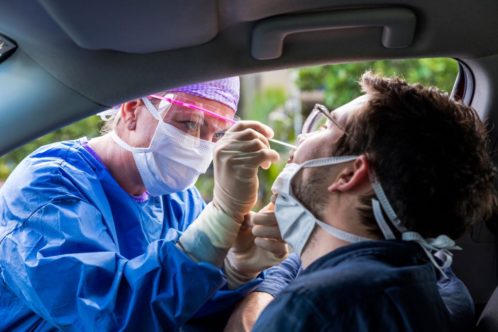man being tested at drive up site