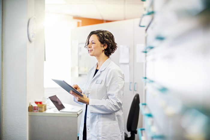 Female pharmacist with a digital tablet