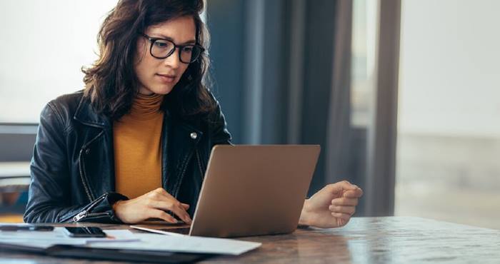 Woman working with laptop at office