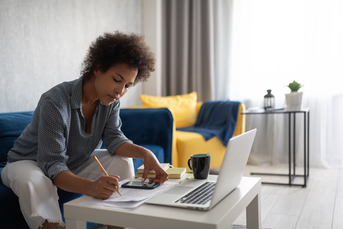 Woman analyzing finances at home