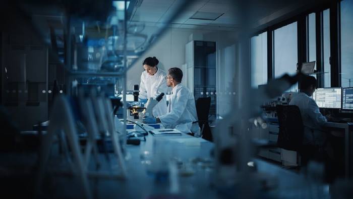 Scientists working at medical research laboratory
