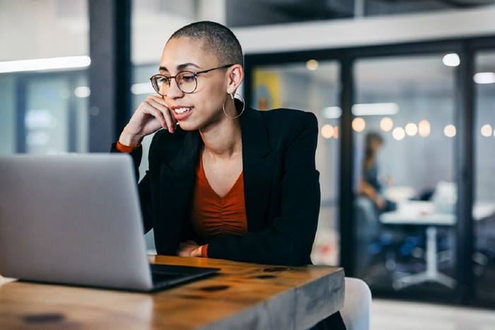Woman attending a virtual meeting in an office