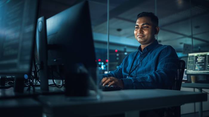 Man working in office at night