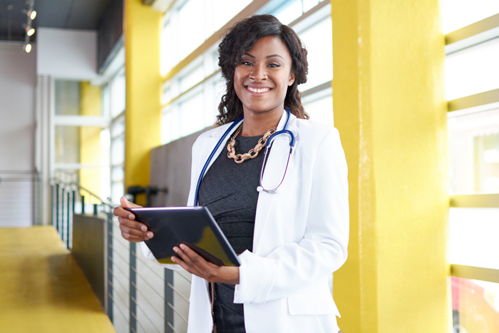 Portrait of female doctor holding digital tablet