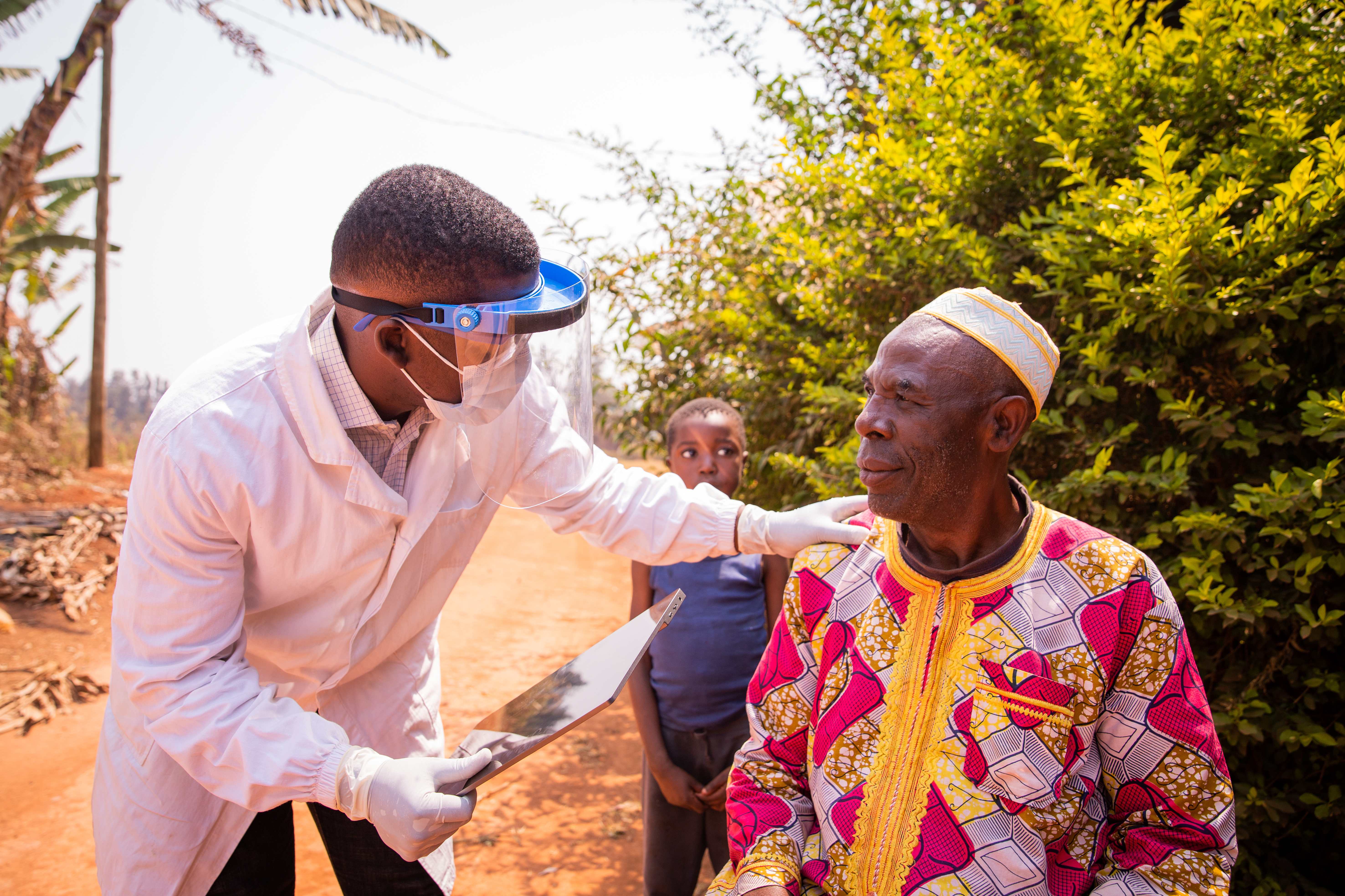 African doctor visits elderly patient