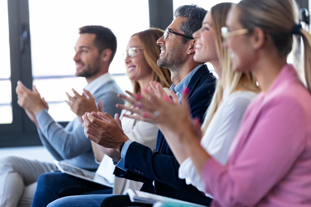 People clapping after event or conference