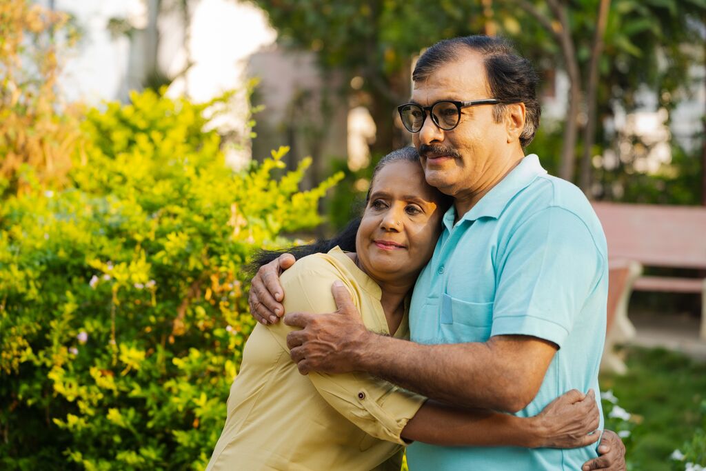 Indian woman hugging husband