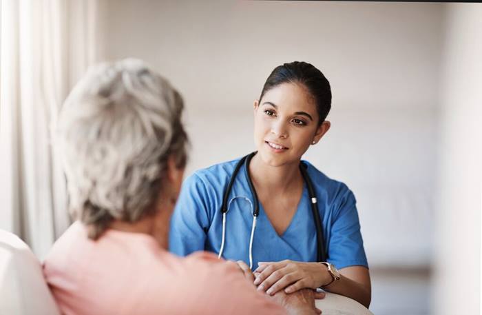 Nurse or doctor with a patient explaining a diagnosis after consultation