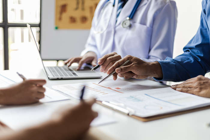 Healthcare staff discussing statistics results of research