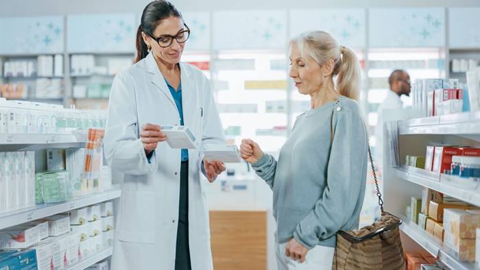 Pharmacist Helping Customer with Medicine Recommendation