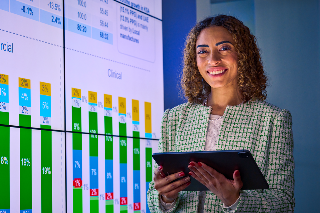 Custom Photo Female smiling while holding tablet
