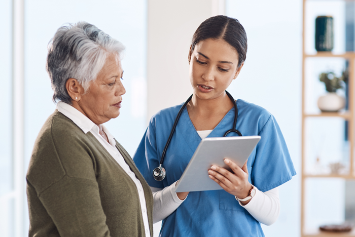 Doctor talking to senior patient