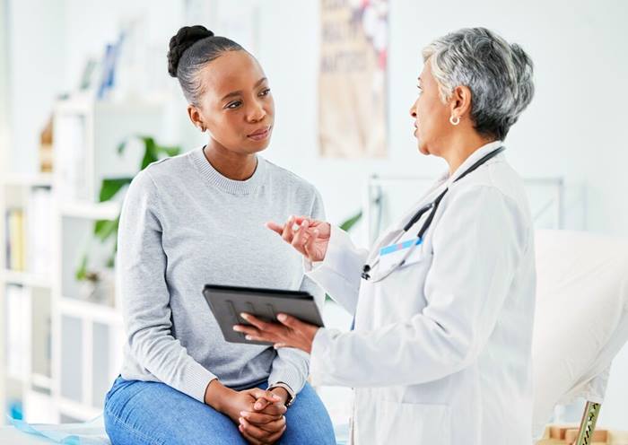 Doctor and patient using tablet