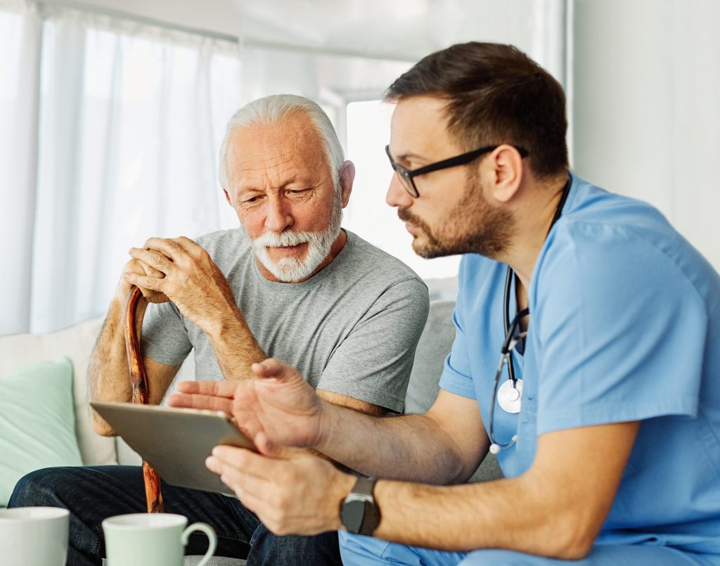 Nurse using tablet with a man