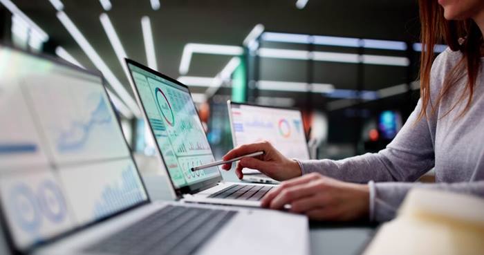 Young woman analyzing business KPI data