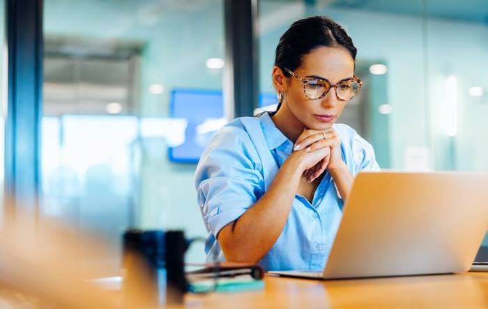 Businesswoman focusing on her laptop