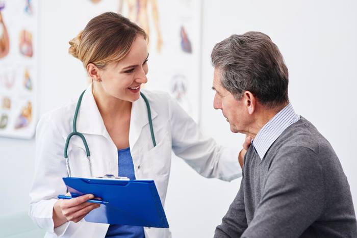 Doctor giving good news to a patient